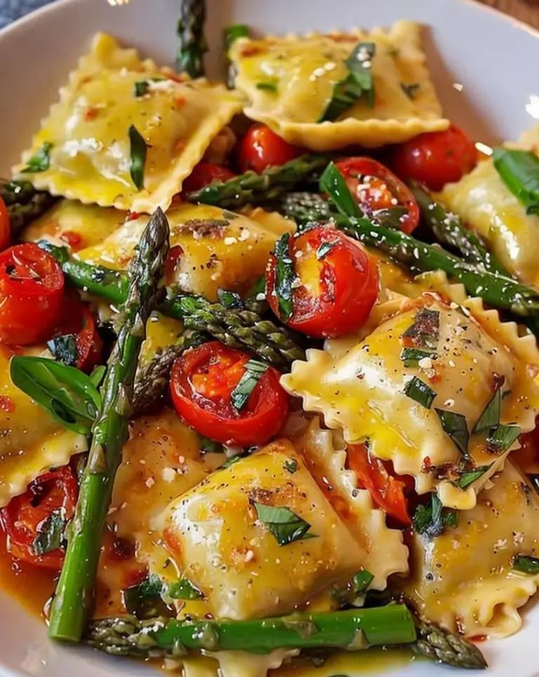 Delicious Ravioli with Fresh Tomatoes, Asparagus, Garlic, and Herbs ...